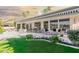 Spacious backyard with patio, lawn, and lake view at 24426 S Ribbonwood Dr, Sun Lakes, AZ 85248
