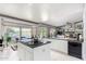 Kitchen boasts white cabinets, granite counters, and an island at 24426 S Ribbonwood Dr, Sun Lakes, AZ 85248