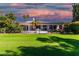 House with a backyard, featuring a patio and lush greenery at 24426 S Ribbonwood Dr, Sun Lakes, AZ 85248