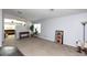 Living room with tile and carpet flooring, and view to the couch at 2423 E Pony Ln, Gilbert, AZ 85295