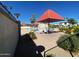 Relaxing pool area with patio furniture and shade structure at 14416 N Teakwood Ln # D, Fountain Hills, AZ 85268