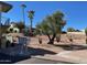Landscaped grounds with desert plants and palm trees at 14416 N Teakwood Ln # D, Fountain Hills, AZ 85268