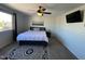 Spacious main bedroom with ceiling fan and wall-mounted TV at 14416 N Teakwood Ln # D, Fountain Hills, AZ 85268
