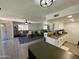 Open floor plan with kitchen island and living room with tile floors at 14416 N Teakwood Ln # D, Fountain Hills, AZ 85268