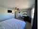 Main bedroom with ceiling fan, large closet, and en suite bathroom at 14416 N Teakwood Ln # D, Fountain Hills, AZ 85268