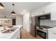 Updated kitchen featuring stainless steel appliances and stylish backsplash at 9339 W Spanish Moss Ln, Sun City, AZ 85373