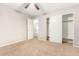 Bedroom with double door closet and access to upper loft at 20293 N 83Rd Dr, Peoria, AZ 85382