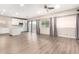 Open concept kitchen with white cabinets and island at 20293 N 83Rd Dr, Peoria, AZ 85382