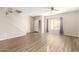 Spacious living room with wood-look floors and ceiling fan at 20293 N 83Rd Dr, Peoria, AZ 85382