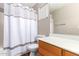 Bathroom with shower, toilet, and vanity with wood cabinets at 20293 N 83Rd Dr, Peoria, AZ 85382
