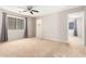 Spacious bedroom with ceiling fan and large closet at 20293 N 83Rd Dr, Peoria, AZ 85382