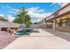 Resort-style backyard with a kidney-shaped pool, spa, and covered patio at 20293 N 83Rd Dr, Peoria, AZ 85382