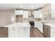 Modern kitchen with white cabinets and stainless steel appliances at 20293 N 83Rd Dr, Peoria, AZ 85382
