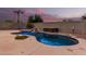 Private backyard retreat with a kidney-shaped pool, spa, and waterfall feature at 20293 N 83Rd Dr, Peoria, AZ 85382