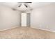 Bedroom with ceiling fan and access to hallway at 20293 N 83Rd Dr, Peoria, AZ 85382