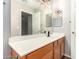 Double vanity bathroom with wood cabinets and modern fixtures at 20293 N 83Rd Dr, Peoria, AZ 85382