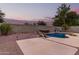 Inviting kidney-shaped pool with waterfall and spa in a beautifully landscaped backyard at 20293 N 83Rd Dr, Peoria, AZ 85382