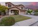 Two-story house with a large yard, two-car garage, and neutral color scheme at 20293 N 83Rd Dr, Peoria, AZ 85382