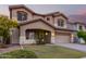 Two-story house with a large yard, two-car garage, and neutral color scheme at 20293 N 83Rd Dr, Peoria, AZ 85382