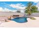Large kidney shaped pool with a waterfall and spa at 20293 N 83Rd Dr, Peoria, AZ 85382