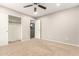Spacious bedroom with ceiling fan and walk-in closet at 20293 N 83Rd Dr, Peoria, AZ 85382