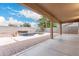 Spacious backyard with a sparkling pool, spa, and covered patio area at 20293 N 83Rd Dr, Peoria, AZ 85382