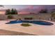 Relaxing kidney-shaped pool with waterfall and spa, perfect for entertaining at 20293 N 83Rd Dr, Peoria, AZ 85382