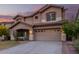 Two-story house with a large yard, two-car garage, and neutral color scheme at 20293 N 83Rd Dr, Peoria, AZ 85382