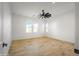 Spacious bedroom featuring hardwood floors and large windows with shutters at 17266 W Vacaville St, Surprise, AZ 85388