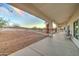 Covered patio overlooking a large backyard with mountain views at 3923 W Fox Rd, Laveen, AZ 85339