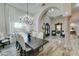 Bright dining room features a chandelier, wood floors and views to the backyard at 3923 W Fox Rd, Laveen, AZ 85339