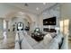 Living area features a large sectional sofa, fireplace and hardwood floors at 3923 W Fox Rd, Laveen, AZ 85339