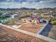 Aerial view of a house with a large backyard, patio, and mountain views at 3923 W Fox Rd, Laveen, AZ 85339