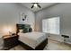 Guest bedroom with a comfortable bed, wood floors and lots of natural light at 3923 W Fox Rd, Laveen, AZ 85339