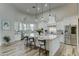 Gourmet kitchen boasts granite island, stainless steel appliances, and white cabinetry at 3923 W Fox Rd, Laveen, AZ 85339