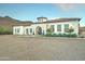 Front view of a beautiful home showcasing a Spanish architectural style at 3923 W Fox Rd, Laveen, AZ 85339