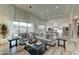 Open-concept living area showcasing a kitchen and large windows at 3923 W Fox Rd, Laveen, AZ 85339