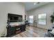 Home office features built-in shelving, hardwood floors and large windows at 3923 W Fox Rd, Laveen, AZ 85339