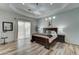 Large main bedroom with a king-size bed and access to the backyard at 3923 W Fox Rd, Laveen, AZ 85339