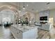 Spacious kitchen with large island, granite countertops and open floor plan to living area at 3923 W Fox Rd, Laveen, AZ 85339
