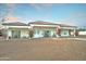 House exterior with covered patio, landscaping, and mountain views at 3923 W Fox Rd, Laveen, AZ 85339