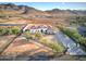 Aerial view of a beautiful home on a large lot with mountain views at 3923 W Fox Rd, Laveen, AZ 85339
