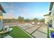 Relaxing outdoor patio with artificial turf and modern seating at 3923 W Fox Rd, Laveen, AZ 85339