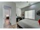 Bright bedroom with a queen bed, desk, and en-suite bathroom access at 3923 W Fox Rd, Laveen, AZ 85339