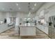 Modern kitchen with large island, stainless steel appliances, and open to living area at 3923 W Fox Rd, Laveen, AZ 85339