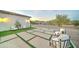 Landscaped backyard with artificial turf and stylish seating at 3923 W Fox Rd, Laveen, AZ 85339