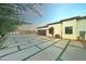 Attached garage with paver driveway and landscaping at 3923 W Fox Rd, Laveen, AZ 85339
