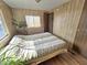 Cozy bedroom with wood flooring and a large bed at 318 S Crismon Rd # 64, Mesa, AZ 85208