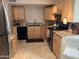 Well-equipped kitchen with granite countertops and wooden cabinets at 5132 N 31St N Way # 134, Phoenix, AZ 85016