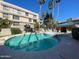 Community pool with surrounding patio at 5132 N 31St N Way # 134, Phoenix, AZ 85016
